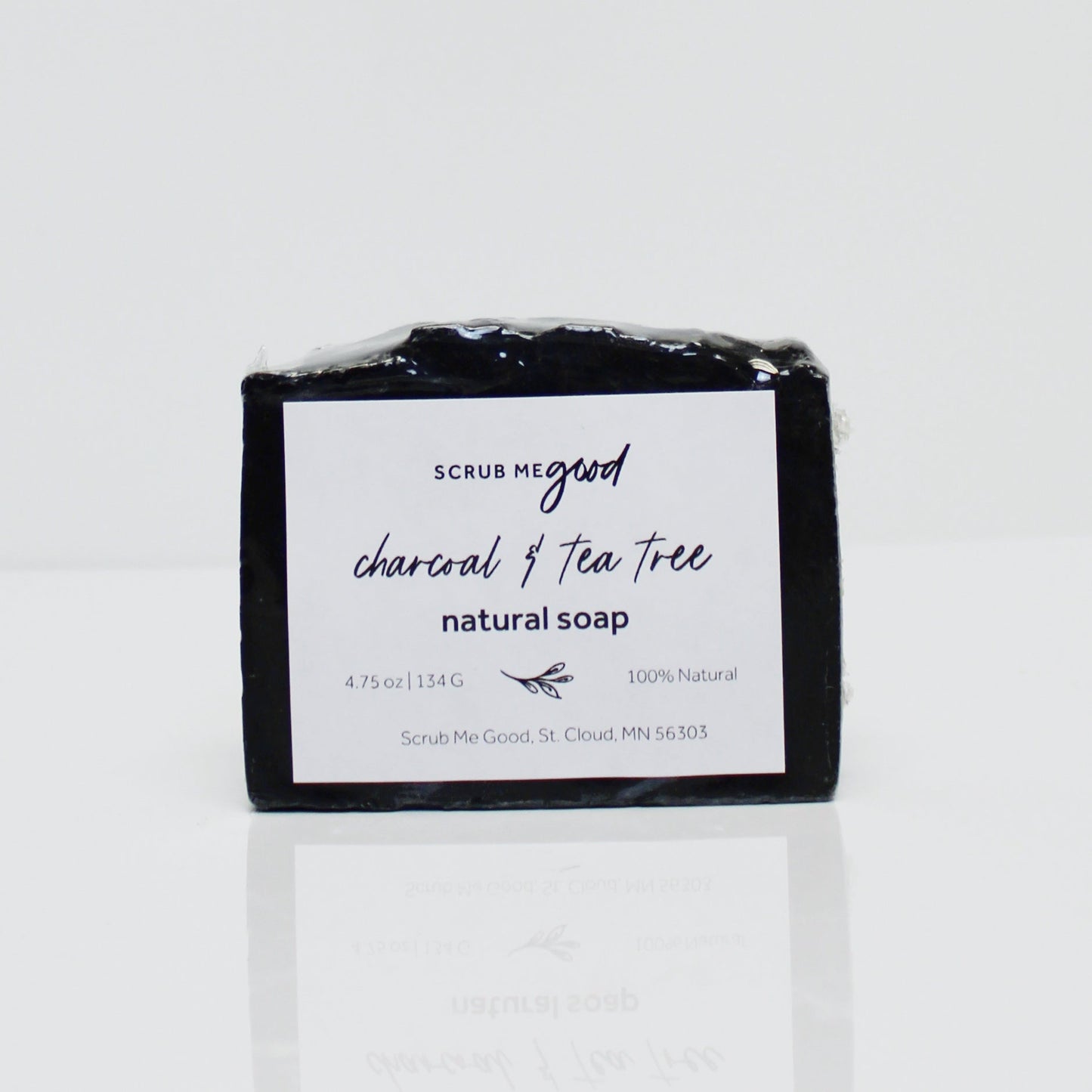 Close-up of charcoal and tea tree soap bar for men